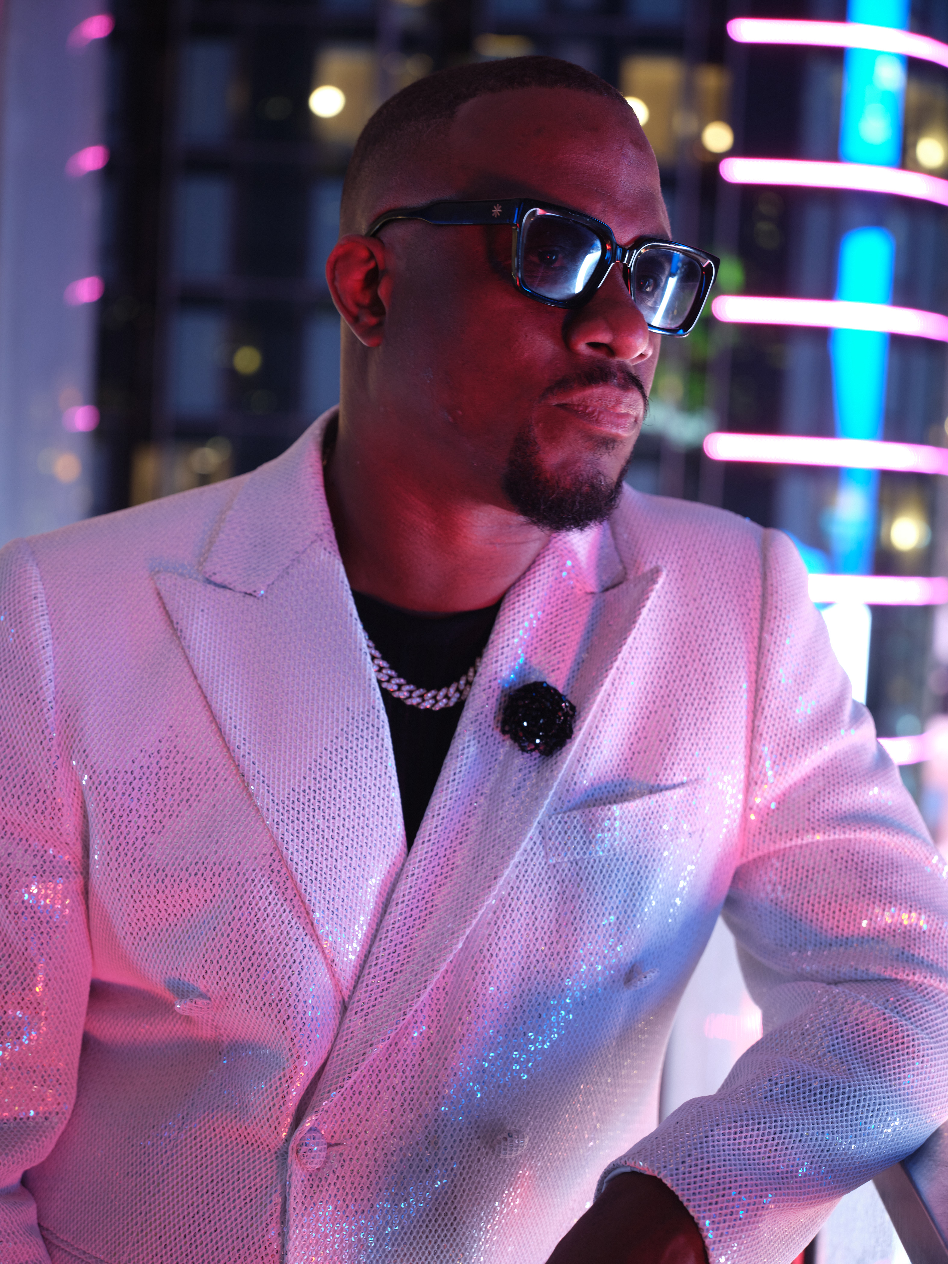 DJ M.O.S. portrait — sparkly blazer